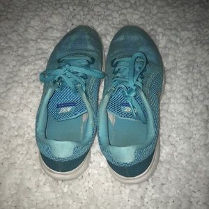 Blue Nike tennis shoes